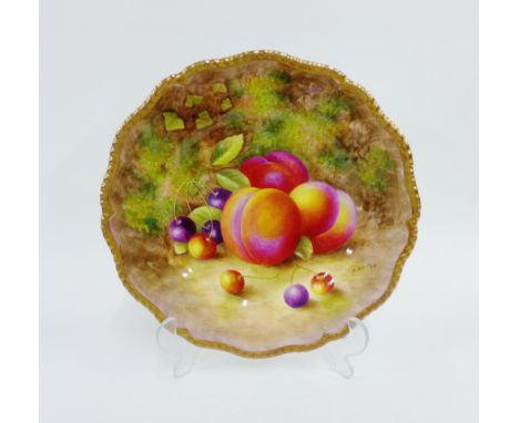 Royal Worcester fruit study plate painted by H Ayrton, with a gilt edged gadroon moulded rim, painted with peaches and cherri
