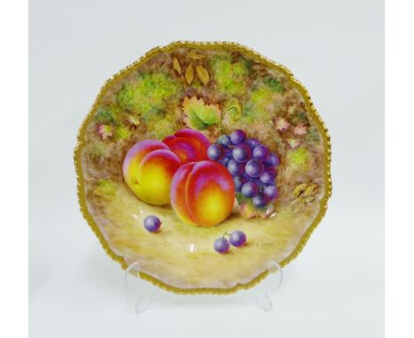 Royal Worcester fruit study cabinet plate painted by H Ayrton, signed, with a gilt edged gadroon moulded rim, painted with pe