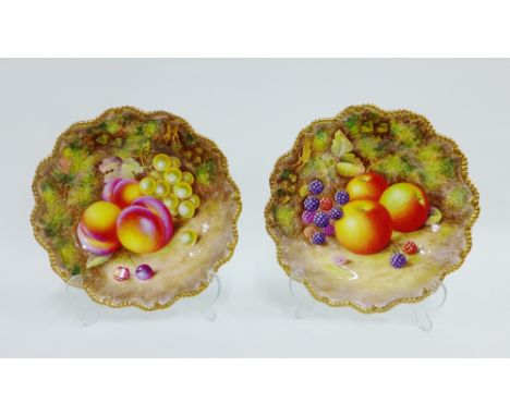 A pair of Royal Worcester fruit study side plates painted by H Ayrton, each with a gilt edged gadroon moulded rim, one painte