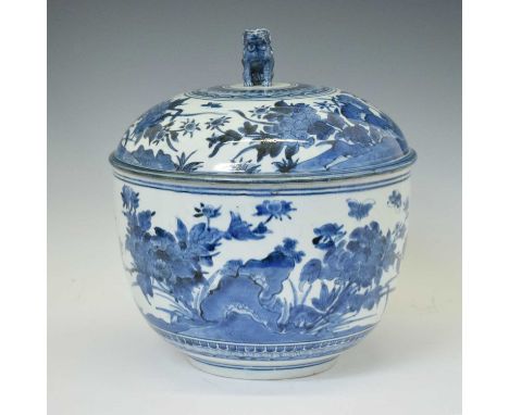 Large Japanese blue and white porcelain bowl with cover, probably Edo period, circa 1700, the domed cover (a/f) with seated k
