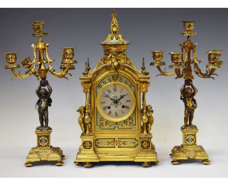 Mid 19th century French gilt brass, ormolu and champlevé enamel three-piece mantel clock garniture, having a 3.5-inch silvere