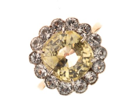 Yellow sapphire and white sapphire cluster ring, the old cushion cut pale yellow sapphire measuring approx 9.5mm x 8.8mm x 6.