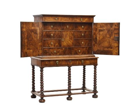 Fine Charles II walnut veneered cabinet on original stand, circa 1670, the cabinet with veneered roof and moulded cornice abo