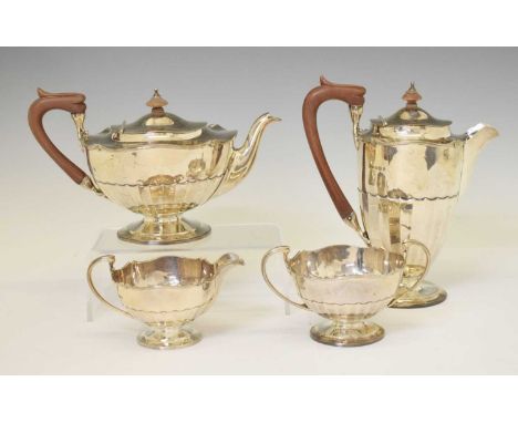 Edward VII silver four-piece tea service comprising teapot, milk jug, sugar basin, and hot water jug, sponsor's marks of Oldf