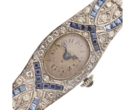 Lady's Art Deco diamond and sapphire platinum cocktail watch, oval silvered dial with black Arabic numerals, the case and art