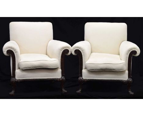 Pair of early 20th century Chippendale revival carved mahogany framed armchairs, each with sprung back and scroll arms with p