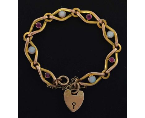 Opal and ruby bracelet, the heart-shaped padlock stamped '9c', the eye-shaped links alternate set a faceted round ruby and op