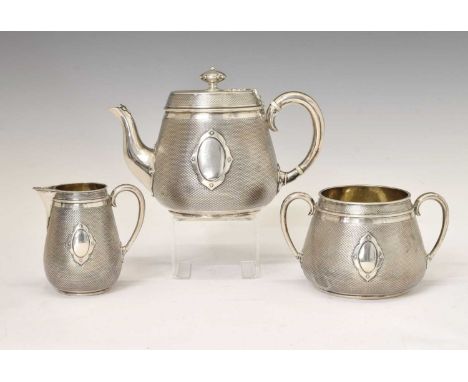 Victorian silver three-piece tea set with all over engine-turned decoration and cut-card mounts, sponsor's mark of Elkington 