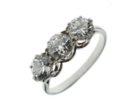 Diamond three stone white metal ring, the three round brilliant cut diamonds each measuring approx. 5.22 x 5.10 x 3.18mm; 5.2
