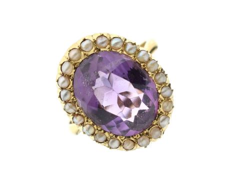 Amethyst and seed pearl cluster ring, the mixed cut amethyst 11mm x 14mm approx, within a border of seed pearls, the undersid