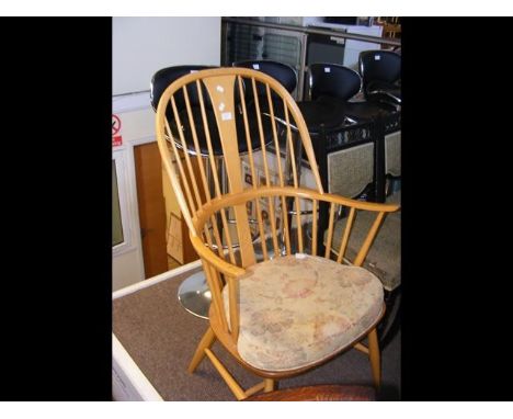 An Ercol stick-back armchairCONDITION REPORTBy our judgement, condition of lot is good.Notably, there are some signs of wear 