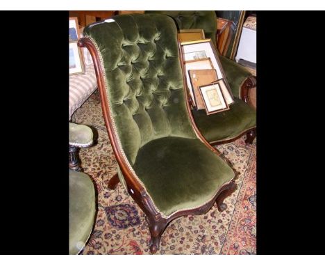 An antique lady's button back chair 