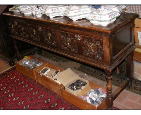 A period oak dresser base with three drawers to the front on turned supportsCONDITION REPORTBy our judgement, condition of lo