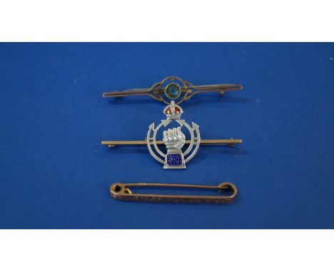 A 9ct gold tie pin; together with an RAC bar brooch, marked 9ct; and another brooch, marked 9ct.