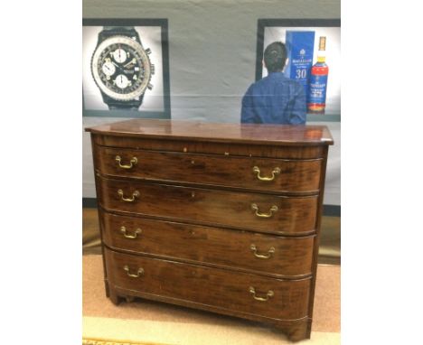 EARLY 20TH CENTURY MAHOGANY BARREL FRONTED CHEST OF DRAWERS, with four cockbeaded graduated drawers, on bracket feet, 118cm w