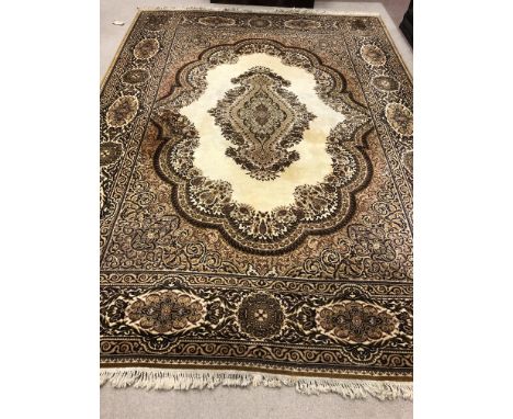 PERSIAN DESIGN CARPET, with a central shaped oval panel on a cream ground and in shades of brown, 420cm x 300cm