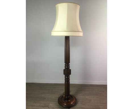 EARLY 20TH CENTURY CARVED MAHOGANY STANDARD LAMP, with fluted and turned cylindrical column, and shade, 185cm high overall