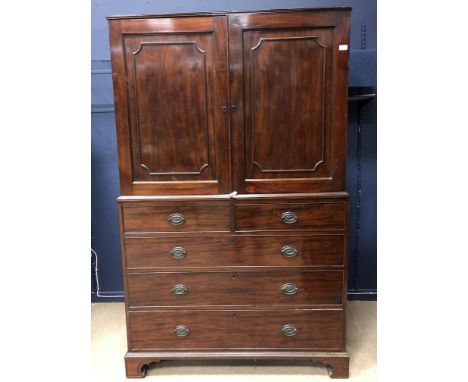 19TH CENTURY MAHOGANY NAPERY CUPBOARD, with two cupboard doors over two short and three long drawers, on bracket feet, 122cm 