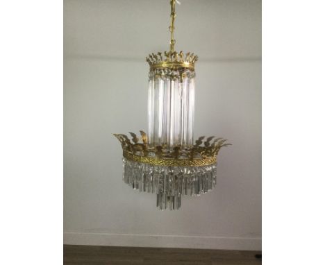 CRYSTAL CHANDELIER, hung with two rows of clear glass prismatic drops from a gilt metal ring cast with inverted foliage, 70cm