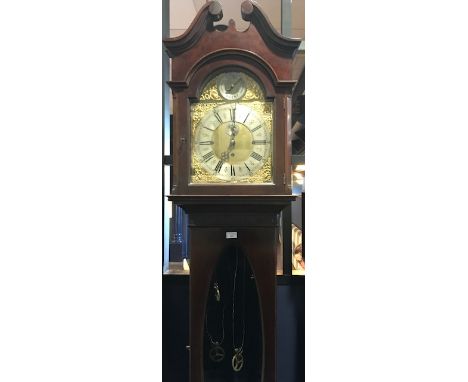 EDWARDIAN CHIMING LONGCASE CLOCKthe lofty hood with swan neck pediment and fretted panels to the side, enclosing an arched br