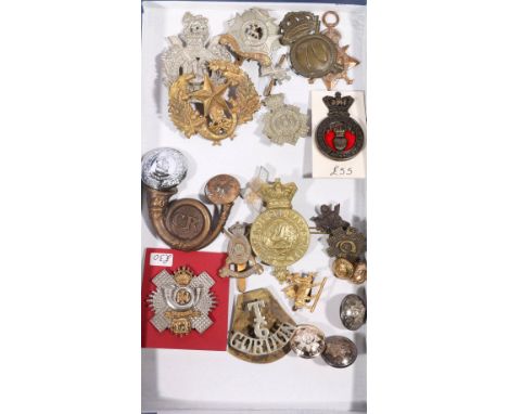 Collection of over eighty cap badges, buttons and shoulder titles, mostly British regiments including:  3rd County of London 