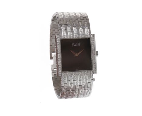 LADY'S PIAGET EIGHTEEN CARAT WHITE GOLD MANUAL WIND COCKTAIL WATCHthe square black dial lacking numerals, 22mm case, on an ei