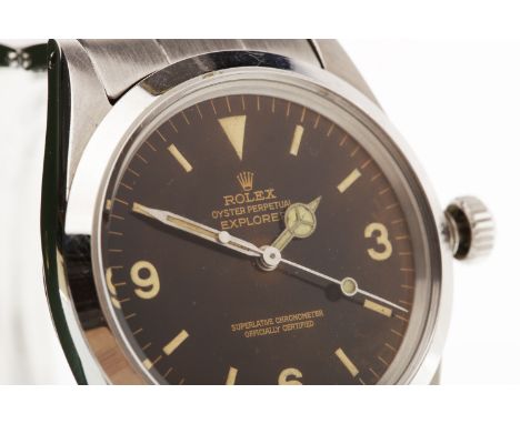 GENTLEMAN'S OYSTER PERPETUAL EXPLORER MANUAL WIND STAINLESS STEEL WRIST WATCHthe round black dial with Arabic numerals in whi