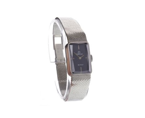 LADY'S OMEGA DE VILLE EIGHTEEN CARAT WHITE GOLD MANUAL WIND WRIST WATCHthe rectangular blue dial with four stainless steel ba