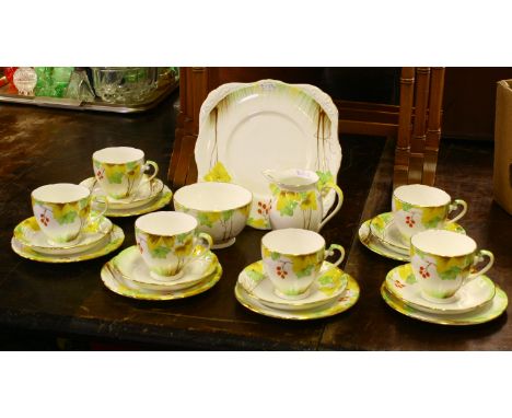 A Royal Grafton bone china tea service hand painted with foliage including six trios, milk jug, sugar bowl and sandwich plate