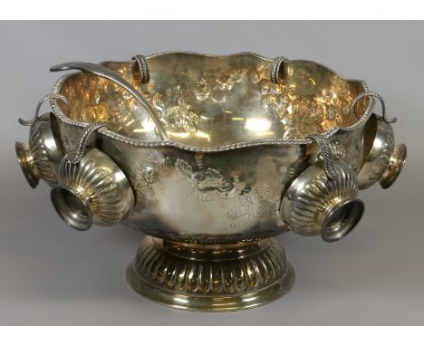 A silver plated pedestal punch bowl chased with floral swags with Kings pattern ladle and six cups.