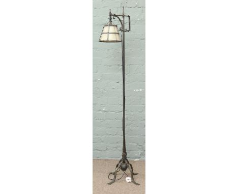 A contemporary standard lamp with Victorian style finials and shade.
