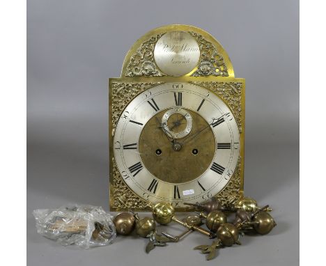 A longcase clock movement with brass arch top dial by Robert Mann Norwich, along with brass finials and a winding key.