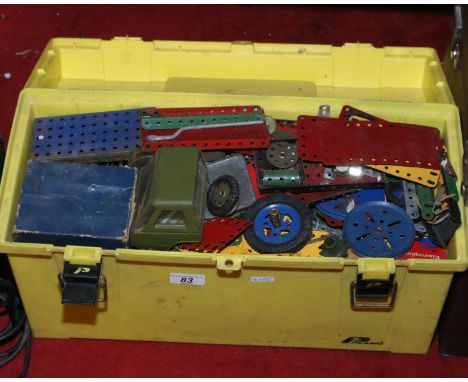 A tool box containing assorted vintage Meccano.