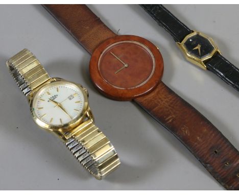 A Tissot quartz wood watch and two ladies Rotary quartz watches.