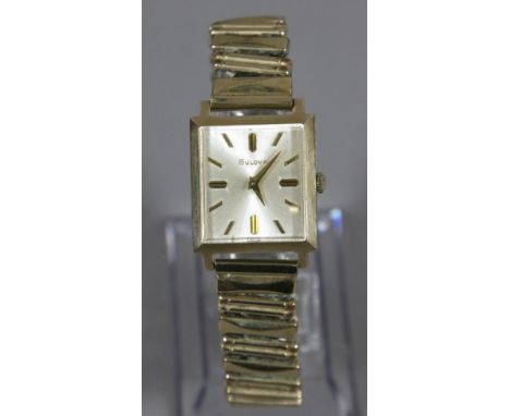A gentleman's vintage Bulova 10ct gold filled manual bracelet watch with rectangular satin dial.