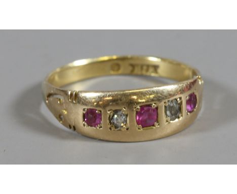 A gold, ruby and diamond five stone ring with pierced shoulders. Size N. Re sized, mark now lacking.