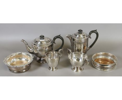 A silver plate four part tea service and two bon bon dishes.
