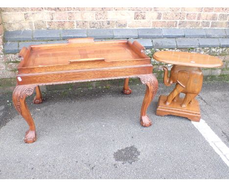 A CHIPPENDALE STYLE BUTLER'S TRAY COFFEE TABLE with scroll handles on stand with carved cabriole legs 56 x 87cm, and a carved