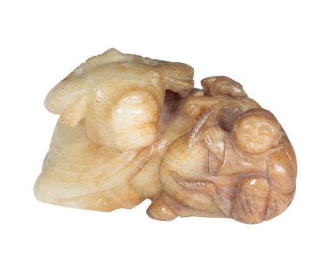 A CHINESE JADE 'BUFFALO AND BOY' GROUP the recumbent buffalo, with the boy clambering on its back, 12cm long 