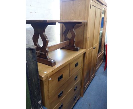 A MODERN LIGHT OAK FINISH CHEST OF DRAWERS 100cm wide, a similar wardrobe 97cm wide, and an oak coffee table (3)