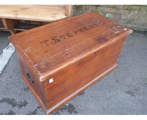 A VICTORIAN STAINED PINE TRUNK stencilled to the lid 'T. STEPHENS' 88cm wide