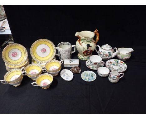 A ROYAL STAFFORD PART TEA SERVICE Early 19th century rococo style, with a collection of ceramics including a John Peel musica