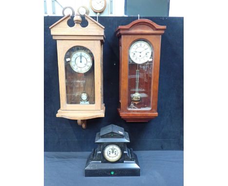 A VICTORIAN SLATE MANTEL CLOCK WITH VISIBLE 'BROCOT' TYPE ESCAPEMENT and pedimented case with malachite inlay striking on a b