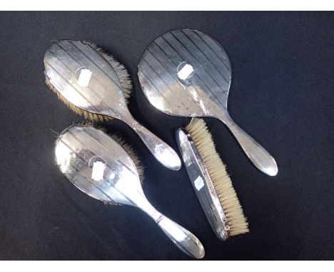 FOUR PIECE SILVER DRESSING TABLE SET with engine-turned decoration, Birmingham 1921