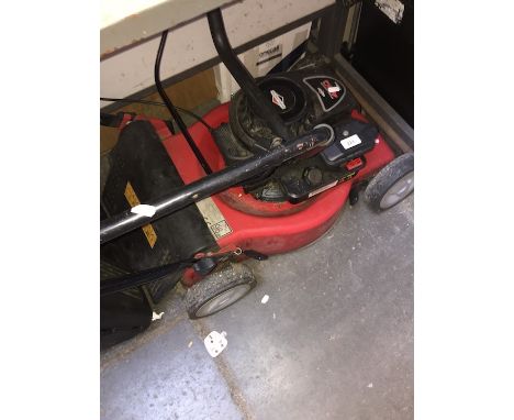 A Sovereign Petrol lawnmower with Briggs and Stratton engine 