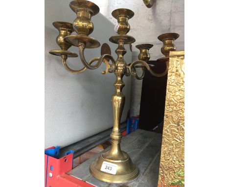A 4 arms brass candlestick holder 