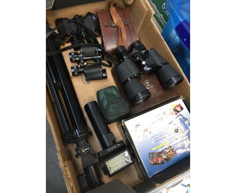 6 pairs of binoculars, cameras and a tripod 