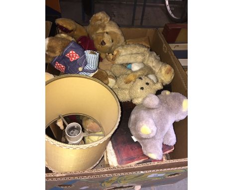 A box of assorted items including soft toys, table lamp and books 