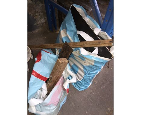 A bag of tools and two wooden measures 