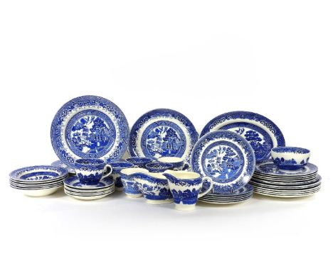 A willow pattern blue and white tea and dinner service
